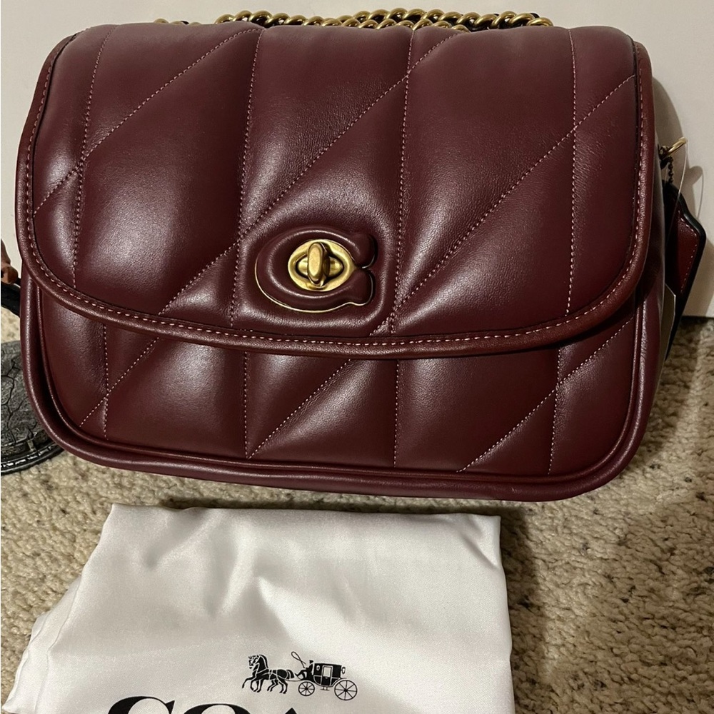 100% authentic 
COACH, the Madison Logo Closure Quilted Pillow